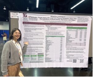Dr. Szu-Wei Chen standing in front of her poster in the 2026 AOTA conference